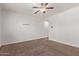 Bedroom with ceiling fan and carpet flooring at 11952 W Overlin Ln, Avondale, AZ 85323