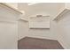 Walk-in closet with shelving and a carpeted floor at 11952 W Overlin Ln, Avondale, AZ 85323