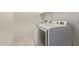 View of a laundry room featuring a side-by-side washer and dryer and tile flooring at 11952 W Overlin Ln, Avondale, AZ 85323