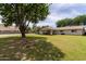 Large, well-maintained backyard with a generous lawn and a covered patio, ideal for entertaining and leisure at 12548 E Cloud Rd, Chandler, AZ 85249