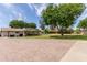 Expansive backyard with lush green lawn and a covered patio for outdoor dining and relaxation at 12548 E Cloud Rd, Chandler, AZ 85249