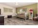Bedroom with tile floors, natural light, ceiling fan, desk, storage shelf, and plenty of space at 12548 E Cloud Rd, Chandler, AZ 85249