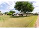 Expansive front yard and charming single-story home provide a peaceful and inviting atmosphere at 12548 E Cloud Rd, Chandler, AZ 85249