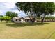 Well-maintained home with large, lush lawn and mature trees offer a serene setting at 12548 E Cloud Rd, Chandler, AZ 85249