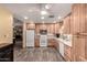 Spacious kitchen with wood cabinetry, modern appliances, and ample counter space at 12548 E Cloud Rd, Chandler, AZ 85249
