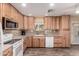 Bright kitchen featuring custom wood cabinets, modern appliances and stylish backsplash at 12548 E Cloud Rd, Chandler, AZ 85249