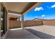 Covered backyard patio with rock landscaping offering space for outdoor enjoyment at 1268 E Jahns Dr, Casa Grande, AZ 85122