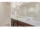 A modern bathroom with double sinks, a large mirror, and a glass-enclosed shower at 1268 E Jahns Dr, Casa Grande, AZ 85122