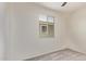 Bedroom showcasing neutral carpet, white walls, window with blinds, and ceiling fan at 1268 E Jahns Dr, Casa Grande, AZ 85122