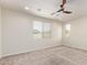 A spacious bedroom features neutral carpet, natural light, and a ceiling fan at 1268 E Jahns Dr, Casa Grande, AZ 85122