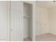Neutral bedroom featuring carpet floors, closet with sliding doors, and a door leading to another area at 1268 E Jahns Dr, Casa Grande, AZ 85122