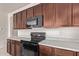 A modern kitchen features stainless steel appliances and ample cabinet space for storage at 1268 E Jahns Dr, Casa Grande, AZ 85122