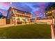 Well-manicured yard with covered patio and string lights, perfect for outdoor enjoyment at 1349 N Lakeshore Dr, Chandler, AZ 85226