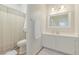 Bathroom featuring vanity with sink and mirror, toilet, and shower with curtain at 1349 N Lakeshore Dr, Chandler, AZ 85226