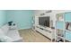 Versatile bonus room with wood floors, calming paint colors, and built-in shelving, perfect for relaxing at 1349 N Lakeshore Dr, Chandler, AZ 85226