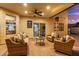 Relaxing covered patio with stylish seating, ceiling fan, and heater for year-round enjoyment at 1349 N Lakeshore Dr, Chandler, AZ 85226