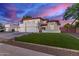 Stunning two-story home with a manicured lawn, red tile roof, and a three-car garage at 1349 N Lakeshore Dr, Chandler, AZ 85226