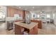 Open kitchen layout features stainless steel appliances, granite countertops, and an eat-in center island at 1349 N Lakeshore Dr, Chandler, AZ 85226