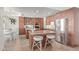 Open kitchen featuring stainless steel appliances, granite countertops, and custom wood cabinetry at 1349 N Lakeshore Dr, Chandler, AZ 85226