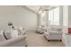 Inviting living room with neutral tones, large windows, and plush seating at 1349 N Lakeshore Dr, Chandler, AZ 85226