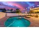 Tranquil pool and spa, enhanced with string lights, perfect for relaxation and entertaining at 1349 N Lakeshore Dr, Chandler, AZ 85226