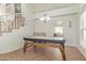 Well-lit game room with air hockey table, adjacent to dining and stairway at 1349 N Lakeshore Dr, Chandler, AZ 85226