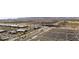 Extensive aerial view showcases a well-developed shopping center with visible highway access and parking at 14601 W Valentine St, Surprise, AZ 85379
