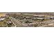 Expansive aerial view of shopping center with multiple businesses and well-organized parking areas at 14601 W Valentine St, Surprise, AZ 85379