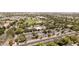 Aerial view of a community with a green baseball field, pool, and parking spots at 14601 W Valentine St, Surprise, AZ 85379
