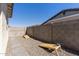 This home offers a backyard area ready for outdoor entertainment with yard games at 14601 W Valentine St, Surprise, AZ 85379