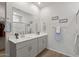 Bathroom featuring double sinks and a bright, neutral color palette at 14601 W Valentine St, Surprise, AZ 85379