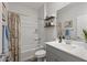 The bathroom offers plenty of natural light and a shower and tub combination at 14601 W Valentine St, Surprise, AZ 85379