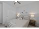 This bedroom offers neutral walls, a ceiling fan, and closet for easy organization at 14601 W Valentine St, Surprise, AZ 85379