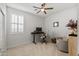 Bedroom featuring a ceiling fan, plush carpet and comfortable furniture at 14601 W Valentine St, Surprise, AZ 85379