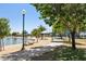 Scenic community park with walking path, lake, trees, picnic pavilions and playground at 14601 W Valentine St, Surprise, AZ 85379