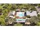 Aerial view of a community pool with lounge chairs, cabanas, and outdoor grilling area at 14601 W Valentine St, Surprise, AZ 85379