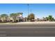 Exterior view of the stadium, featuring a beige building with a tower and light posts at 14601 W Valentine St, Surprise, AZ 85379