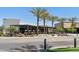 Modern building with palm trees; Eatery O.H.S.O Brewery with outdoor seating at 14601 W Valentine St, Surprise, AZ 85379