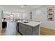 Bright kitchen features a large island, quartz countertop, and neutral tones at 14601 W Valentine St, Surprise, AZ 85379