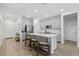 Bright kitchen with a large island, gray cabinetry, and an open layout at 14601 W Valentine St, Surprise, AZ 85379