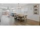 Open-concept living and dining area with tile floors and large windows at 14601 W Valentine St, Surprise, AZ 85379