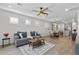 Bright living room showcases wood floors, a neutral sofa, and stylish decor for a welcoming space at 14601 W Valentine St, Surprise, AZ 85379