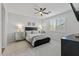 Serene main bedroom boasts a ceiling fan, plantation shutters, and soft neutral tones at 14601 W Valentine St, Surprise, AZ 85379