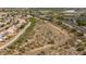 Aerial view of homes near the desert landscape, displaying the residential area's integration with the natural environment at 16010 N 74Th Ln, Peoria, AZ 85382