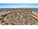 Overhead view showcases neighborhood, desert terrain, and skyline, reflecting the property's location and natural surroundings at 16010 N 74Th Ln, Peoria, AZ 85382