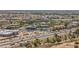 Wide aerial shot of cityscape with highways, commercial buildings, and residential areas, demonstrating the area's vibrant setting at 16010 N 74Th Ln, Peoria, AZ 85382