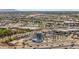 Expansive aerial view featuring a shopping center with ample parking, showcasing the convenience and commercial presence nearby at 16010 N 74Th Ln, Peoria, AZ 85382