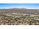 Extensive aerial view of Peoria's residential areas and commercial centers, bordered by mountain ranges at 16010 N 74Th Ln, Peoria, AZ 85382