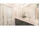 Bathroom featuring a double vanity, gray cabinets, and a tub and shower combination at 16010 N 74Th Ln, Peoria, AZ 85382