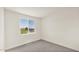Bright bedroom with a large window overlooking the surrounding landscape at 16010 N 74Th Ln, Peoria, AZ 85382